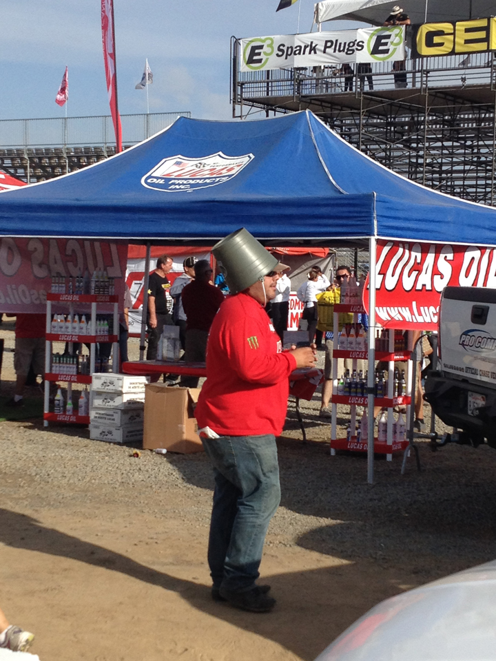 …And we thought the beer box hat was funny. But a bucket works, too.