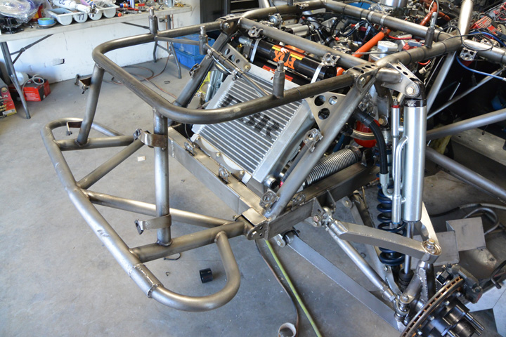 On the front and rear of the chromoly chassis, the bumper sections are made to be unbolted. In short-course racing, there is probably more contact that in almost any other form of motorsport. Subsequently, bumper get bent and replaced all the time. You don’t want to have to cut the bumper section off each time, so you make it removable with bolts.
